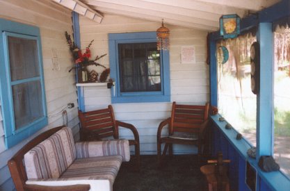 porch on the cottage, cabins on the river in the forest at Gathering Light ... a retreat for nature lovers located in southern oregon near crater lake national park and klamath basin birding trails. cabins, tree houses, rv camping and vacation rentals in the forest on the river near crater lake national park and klamath basin birding trails.